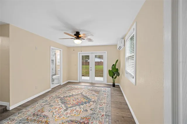 a kitchen with a refrigerator sink and cabinets