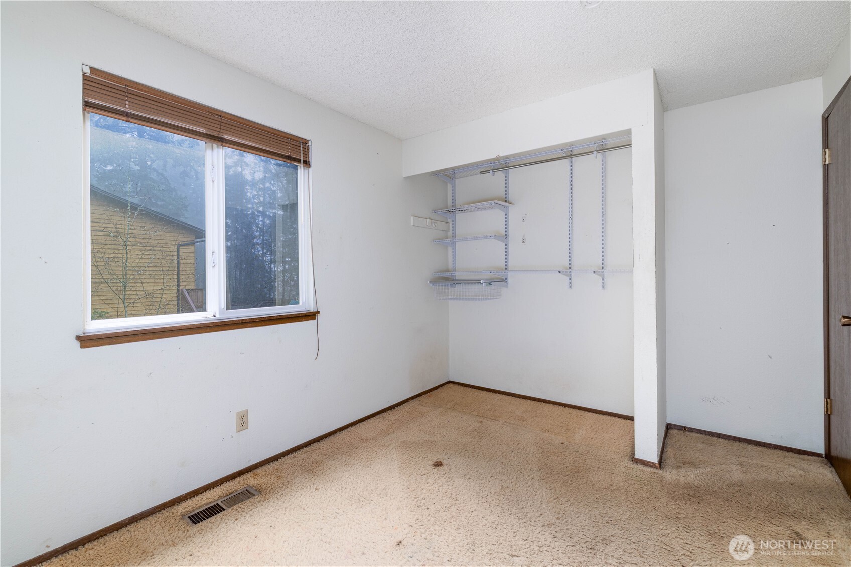 5189 Brasch Road Southeast Port Orchard, WA 98367 - Photo 12 of 24 an empty room with a window
