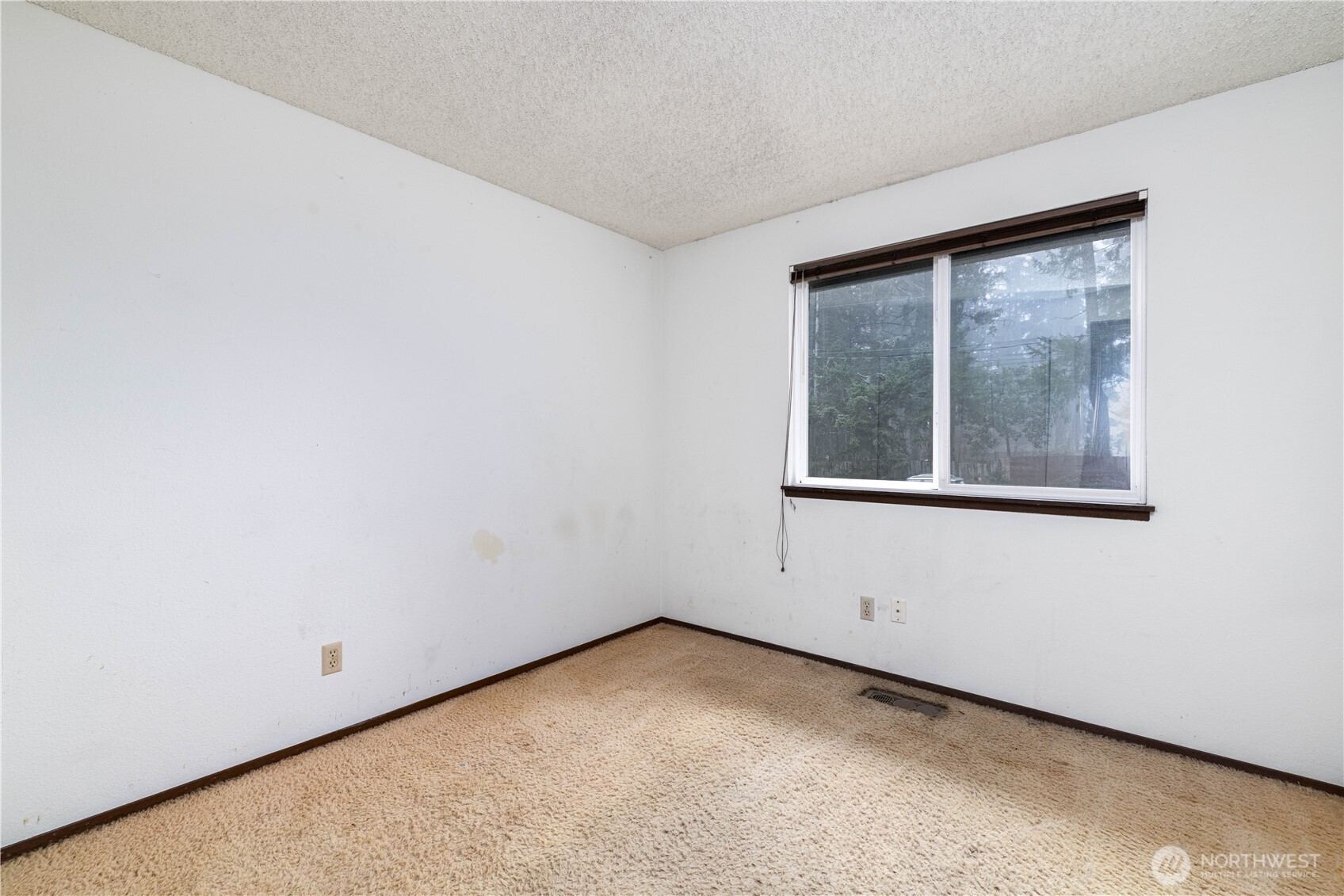 5189 Brasch Road Southeast Port Orchard, WA 98367 - Photo 13 of 24 a view of an empty room with a window