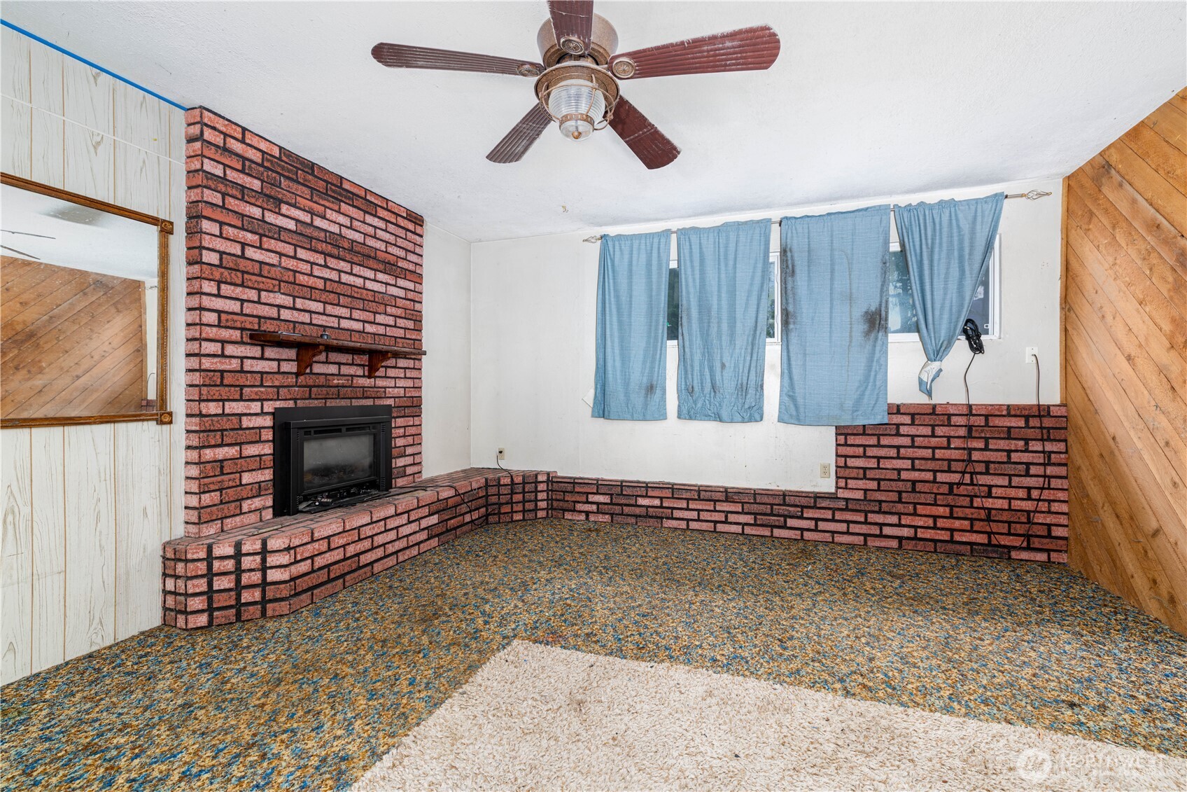 5189 Brasch Road Southeast Port Orchard, WA 98367 - Photo 16 of 24 a view of an empty room with a fireplace