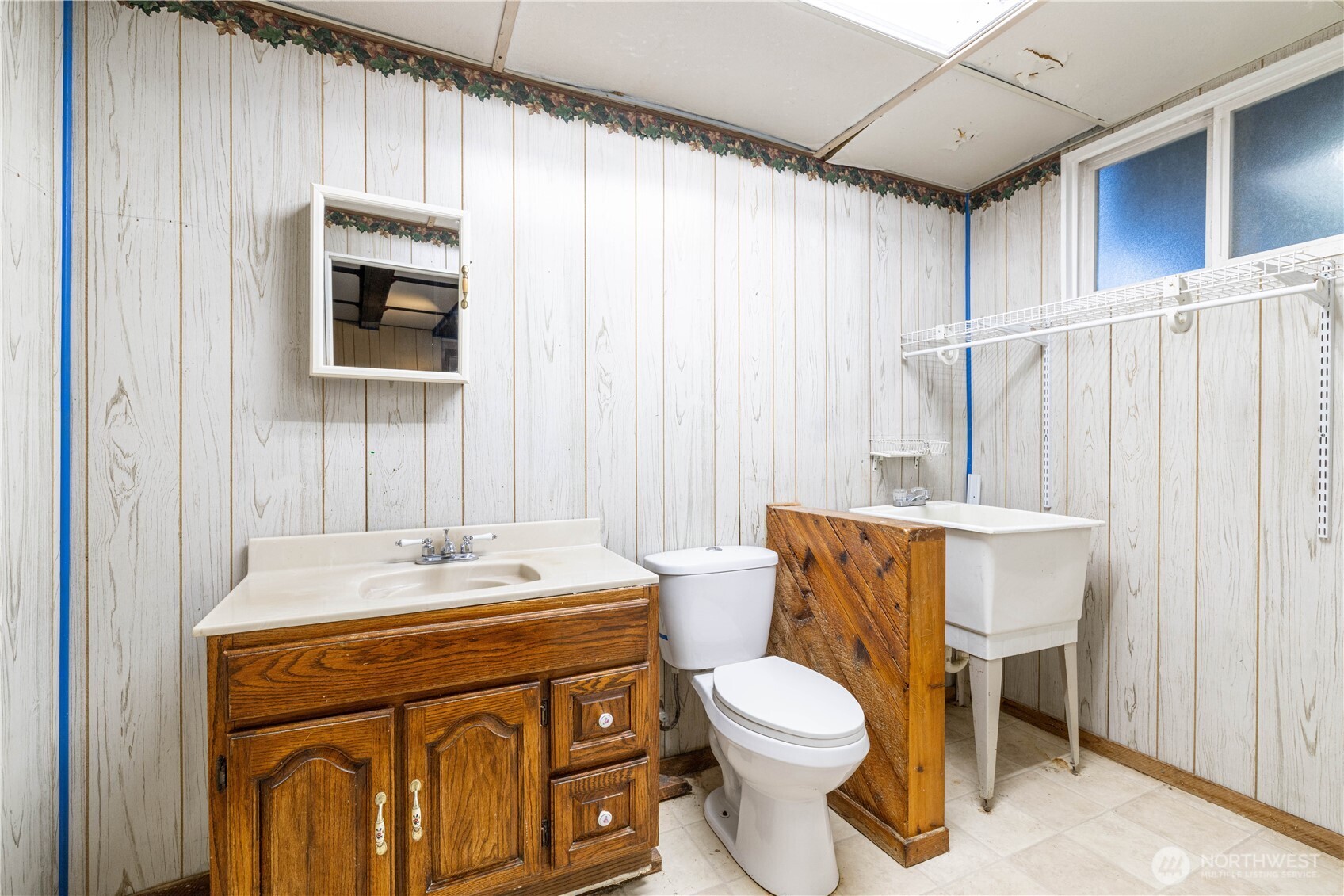 5189 Brasch Road Southeast Port Orchard, WA 98367 - Photo 18 of 24 a bathroom with a sink toilet and shower