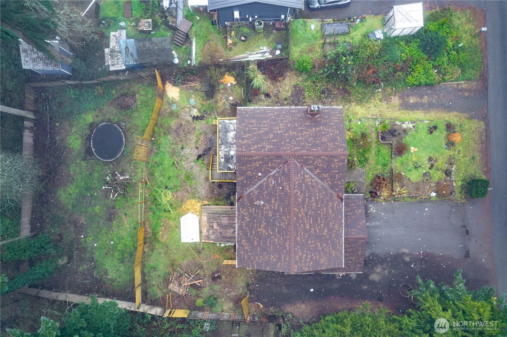 5189 Brasch Road Southeast Port Orchard, WA 98367 - Photo 20 of 24 a aerial view of a house with a yard and garden