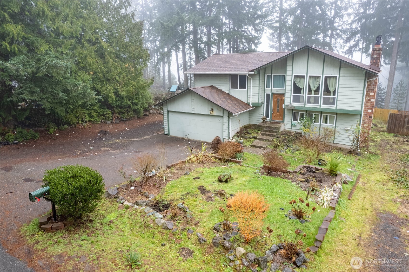 5189 Brasch Road Southeast Port Orchard, WA 98367 - Photo 24 of 24 a front view of a house with a yard