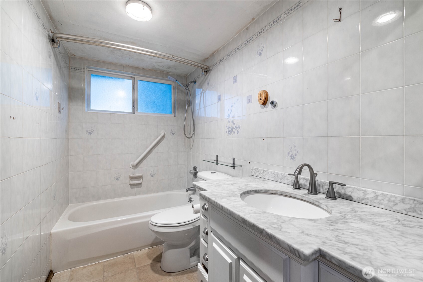 5189 Brasch Road Southeast Port Orchard, WA 98367 - Photo 8 of 24 a bathroom with a granite countertop sink a toilet and bathtub