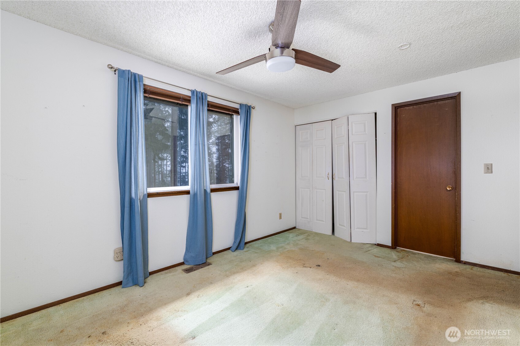 5189 Brasch Road Southeast Port Orchard, WA 98367 - Photo 10 of 24 a view of an empty room with a window