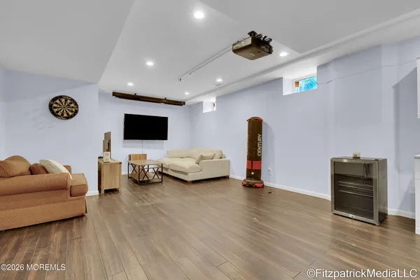 a view of a livingroom with furniture and a flat screen tv