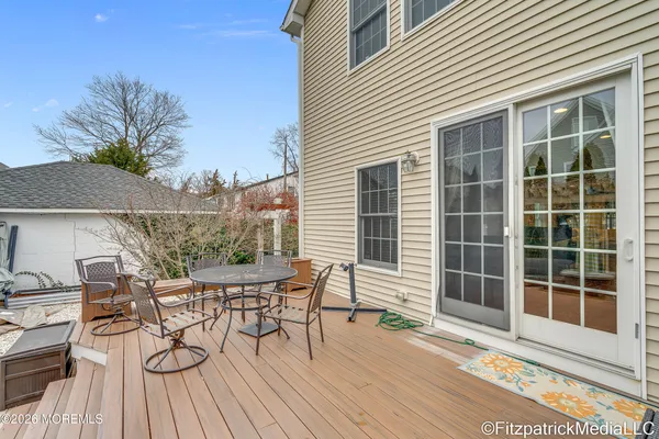 a view of a house with a patio and wooden flooring
