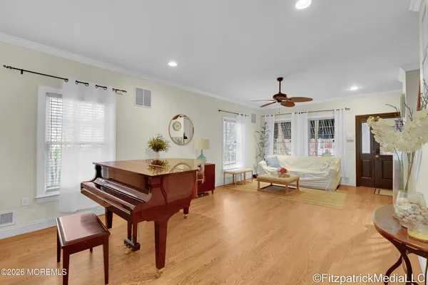 a living room with furniture a table and a large window