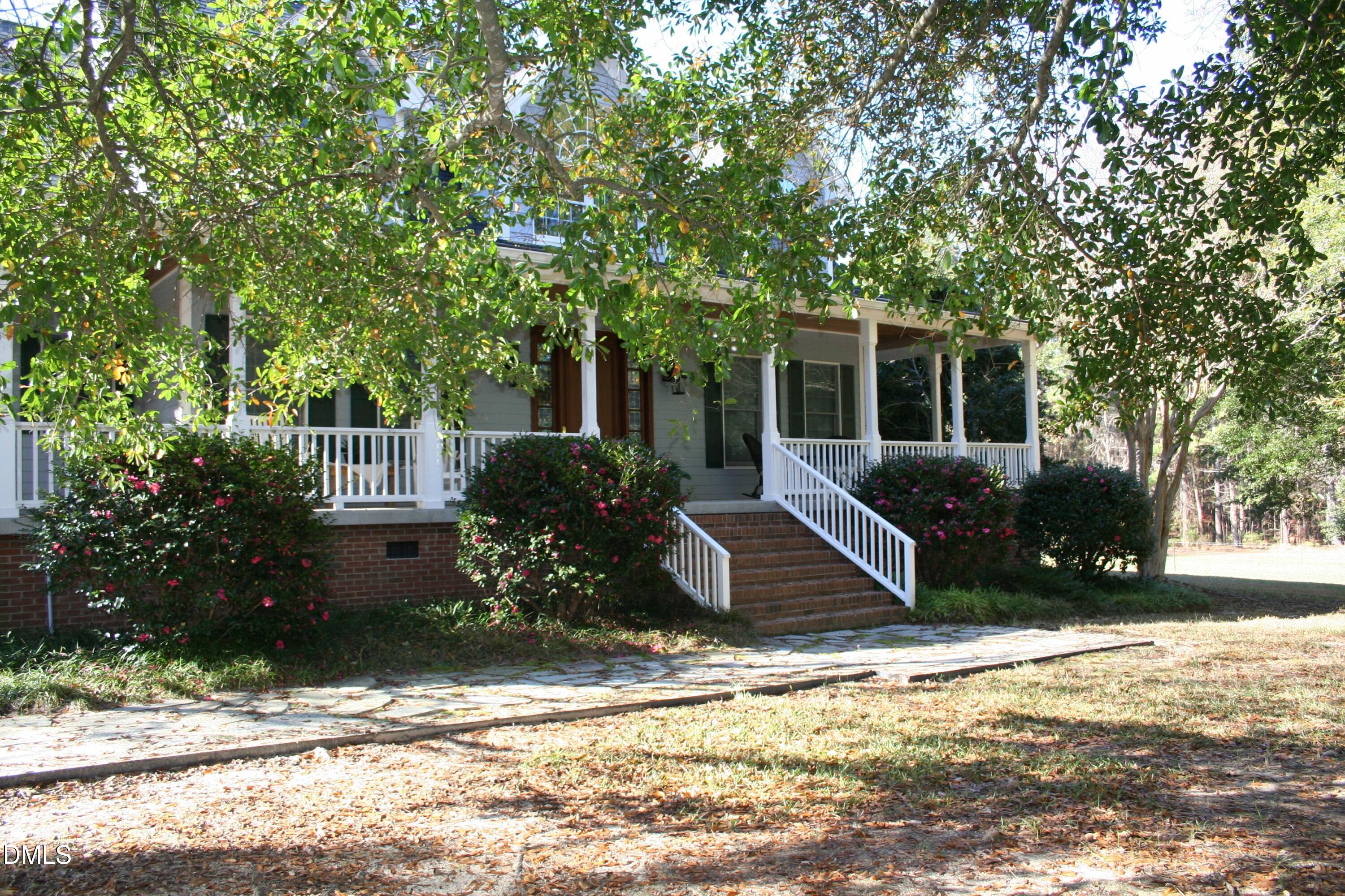 220 Jordan Narron Road Selma, NC 27576 - Photo 8 of 87 a view of a house with backyard and sitting area