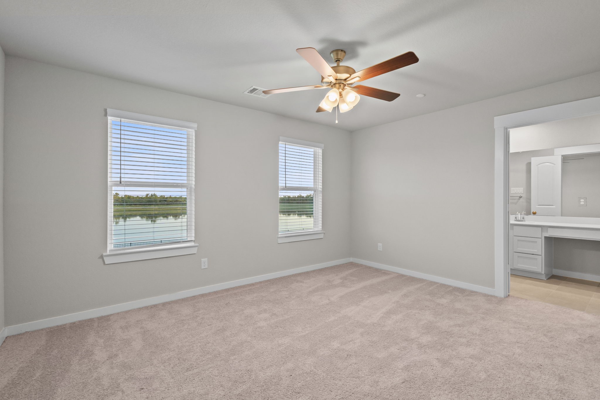 2778 Mariposa Crk Drive, Unit 2 Rosharon, TX 77583 - Photo 11 of 30 As you enter the primary bedroom, you’re greeted by an abundance of natural light pouring in through large, beautifully framed windows, casting a warm glow on the soft, neutral tones of the walls.