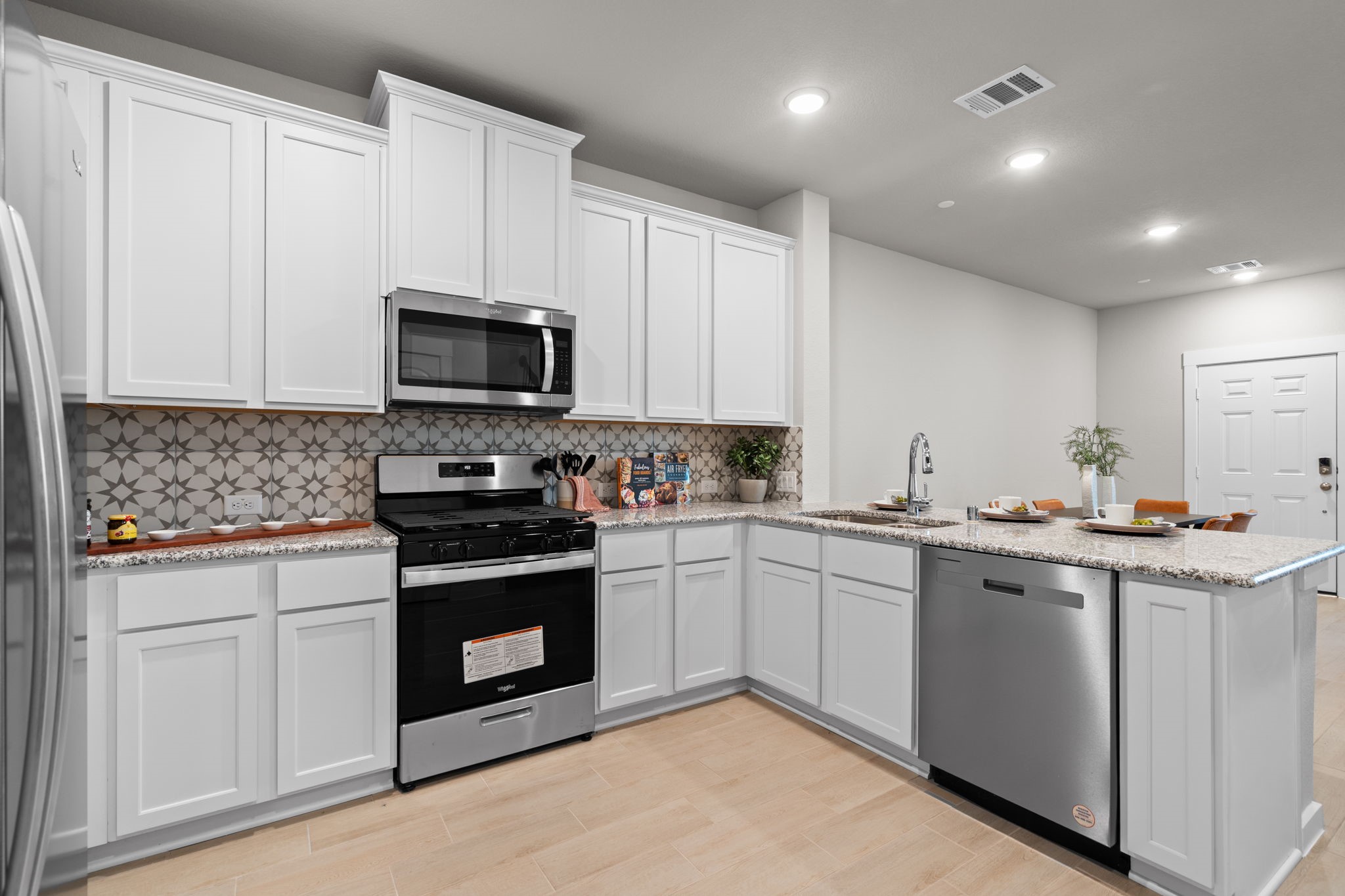 2778 Mariposa Crk Drive, Unit 2 Rosharon, TX 77583 - Photo 7 of 30 Whether you’re a seasoned chef or a novice just learning the ropes, this kitchen invites you to unleash your culinary creativity and savor every moment spent within its inviting walls.