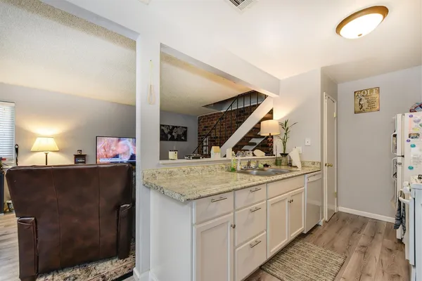 a utility room with sink dryer and washer