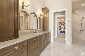 1141 East Lost Ridge Drive Washington, UT 84780 - Photo 63 of 108 Spacious bathroom featuring an extended wood-finish vanity with ample storage