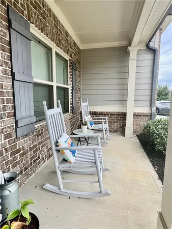 a view of backyard with outdoor seating
