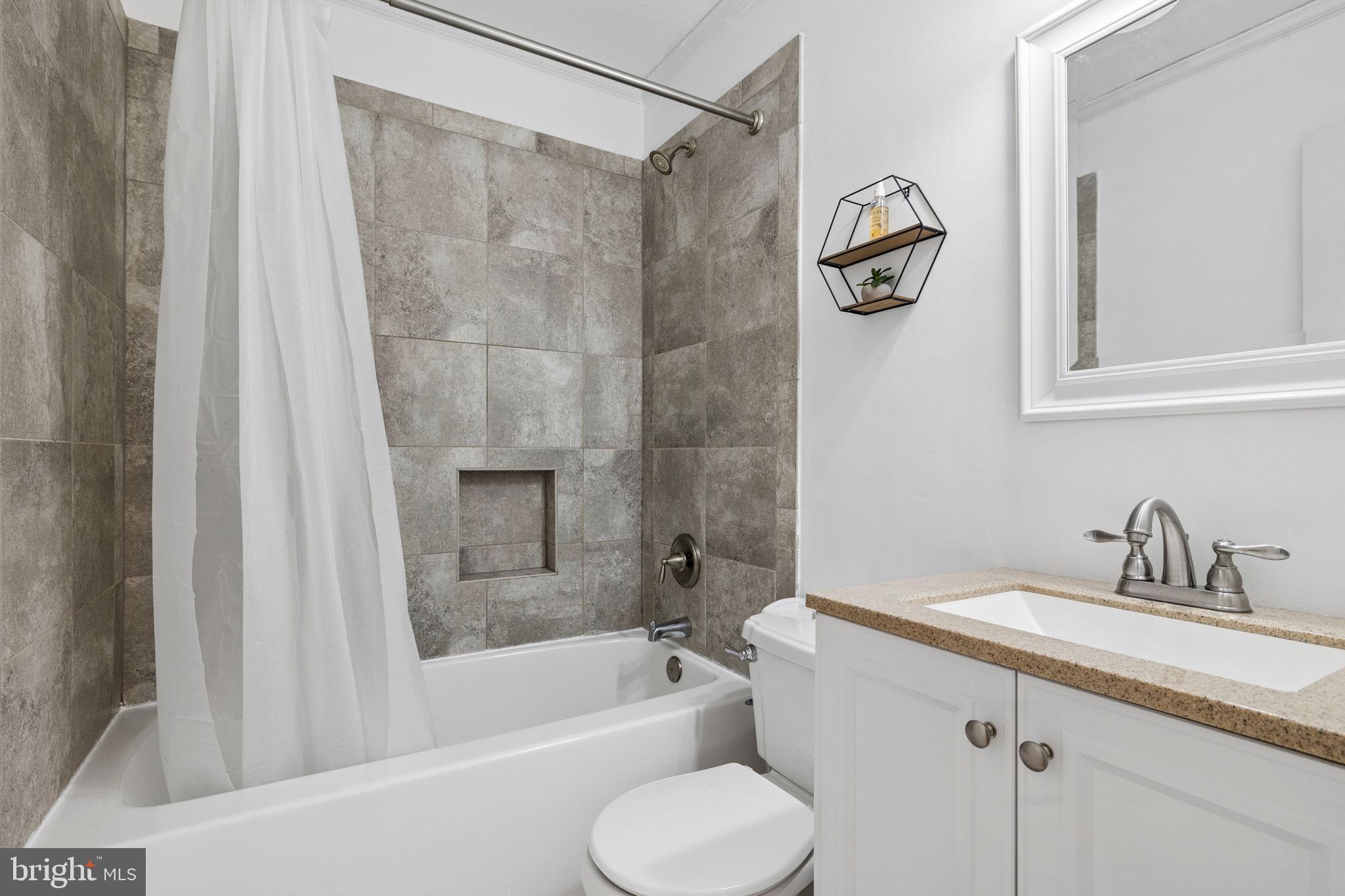 12237 Randle Lane Culpeper, VA 22701 - Photo 17 of 31 a bathroom with a granite countertop sink toilet and shower