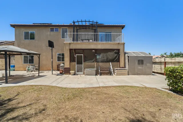a front view of a house with yard and seating space