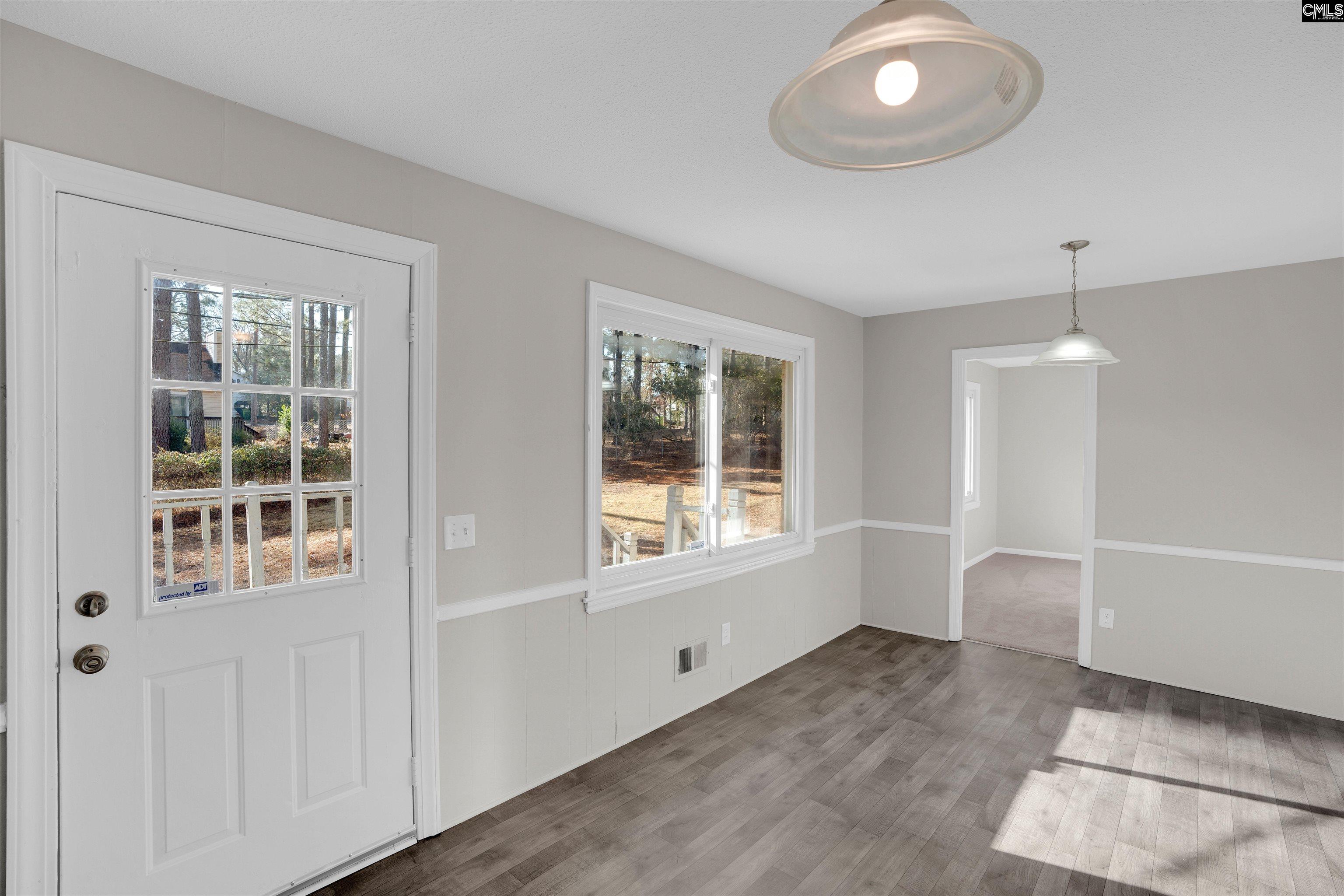 2620 Pleasant Ridge Drive Columbia, SC 29209 - Photo 13 of 37 a view of an empty room with a window and wooden floor