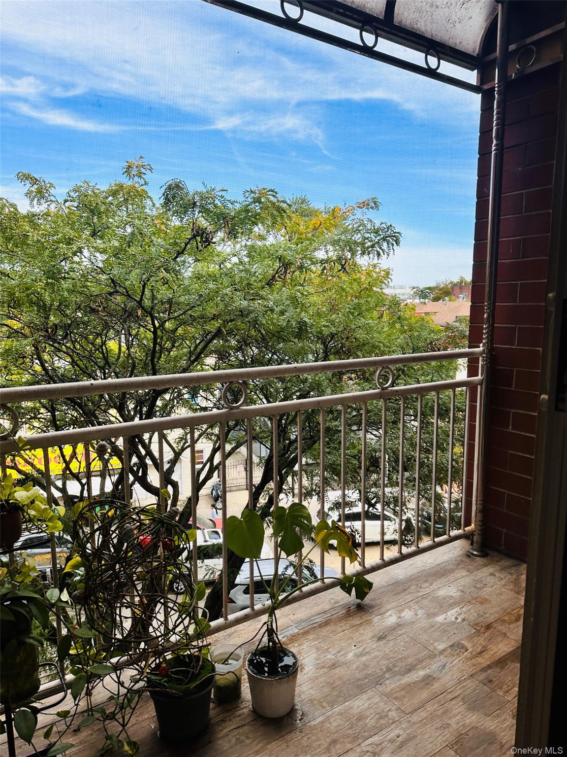 107-16 37th Avenue, Unit 4B Queens, NY 11368 - Photo 7 of 13 a view of swimming pool from a balcony