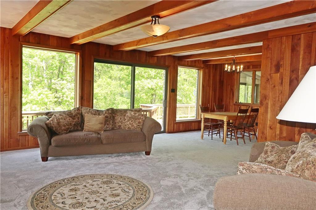 388 Bortz Road Saltsburg, PA 15681 - Photo 12 of 50 Beamed Ceilings, Gas Fireplace, Anderson Windows and Glass Doors offering Splendor on EVERY Side!