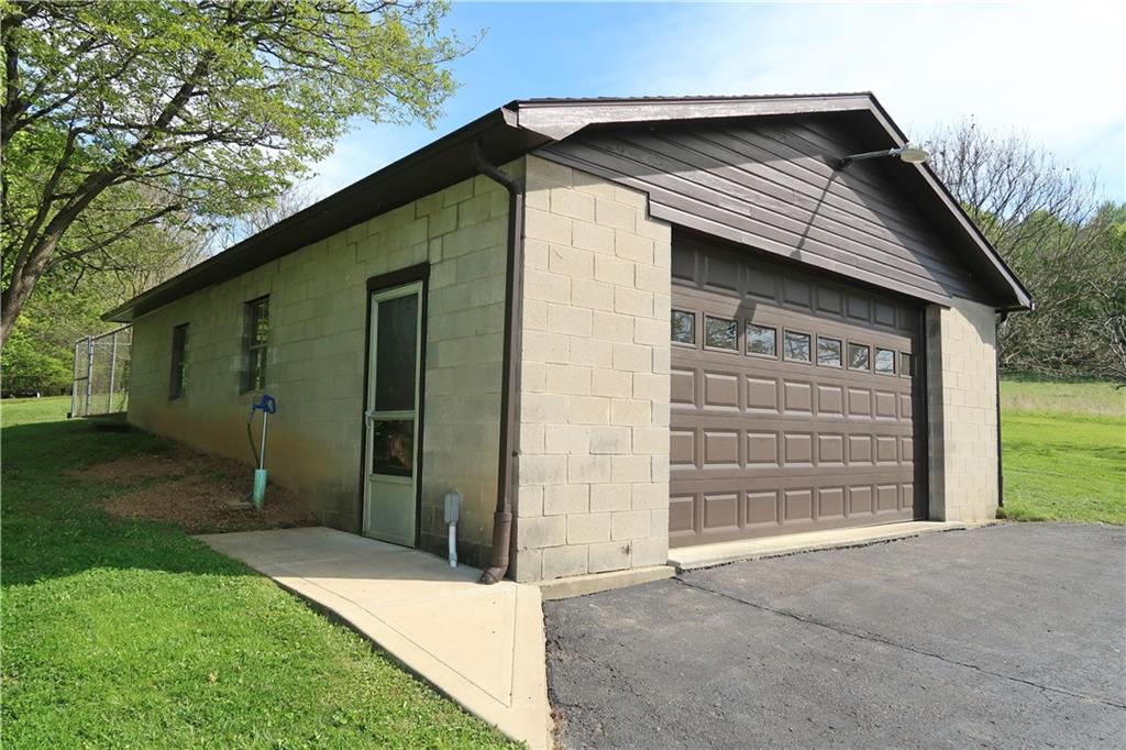 388 Bortz Road Saltsburg, PA 15681 - Photo 33 of 50 Oversisized 36x25 2+ Car HEATED GARAGE with side Man-door and Auto Door Opener, Built in Storage, Pet Fencing, Kennel and Door!
