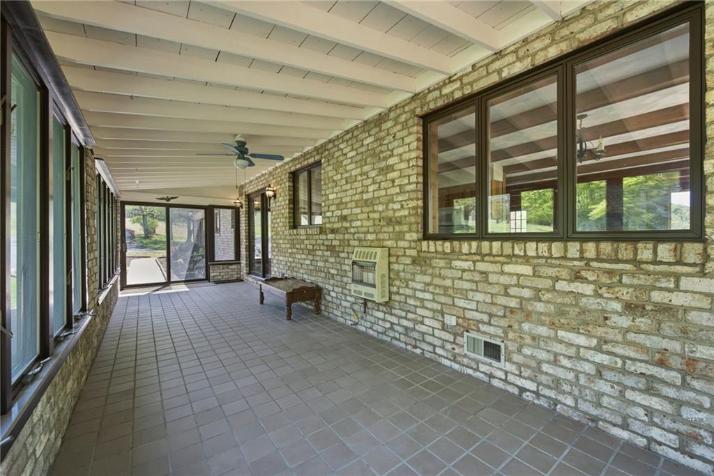 388 Bortz Road Saltsburg, PA 15681 - Photo 8 of 50 30x8 4 SEASON ROOM conveniently located between Kitchen, Backyard, Deck and Garage/The morning Sun makes it a plant-lovers dream!