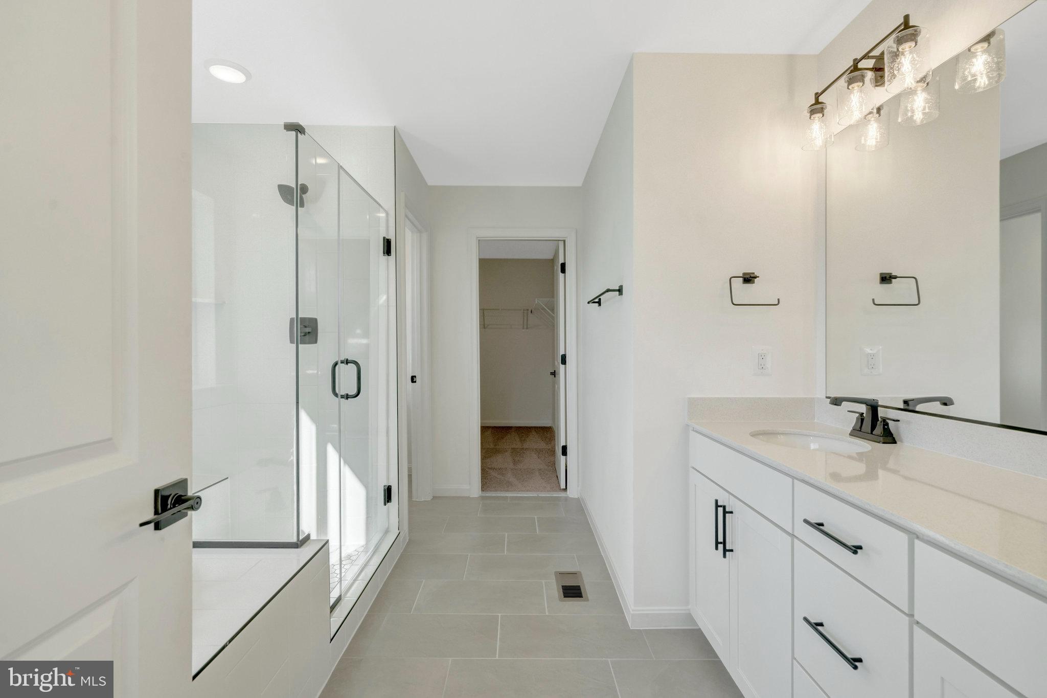 1925 Sunset Lane Culpeper, VA 22701 - Photo 33 of 74 a bathroom with a granite countertop sink mirror and shower