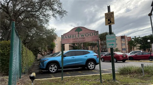a front view of a house with parking space
