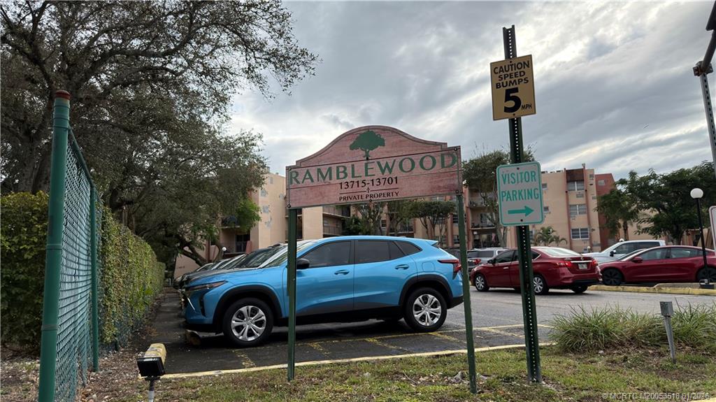 13715 Southwest 66th Street, Unit 415 Miami, FL 33183 - Photo 2 of 20 a front view of a house with parking space