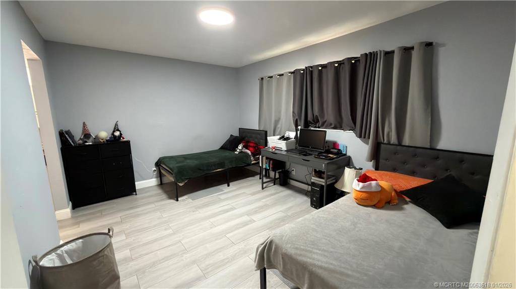 13715 Southwest 66th Street, Unit 415 Miami, FL 33183 - Photo 4 of 20 a living room with furniture and a flat screen tv