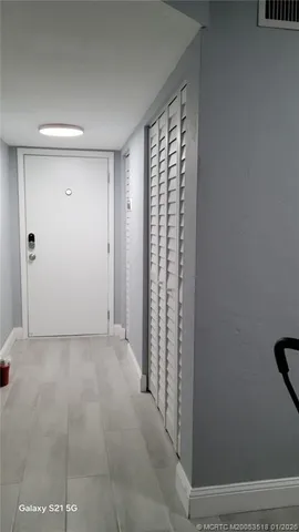 a view of empty room with windows