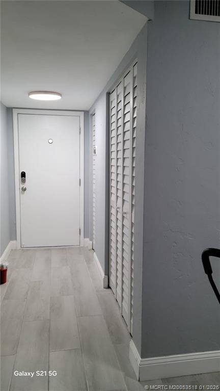 13715 Southwest 66th Street, Unit 415 Miami, FL 33183 - Photo 9 of 20 a view of empty room with windows