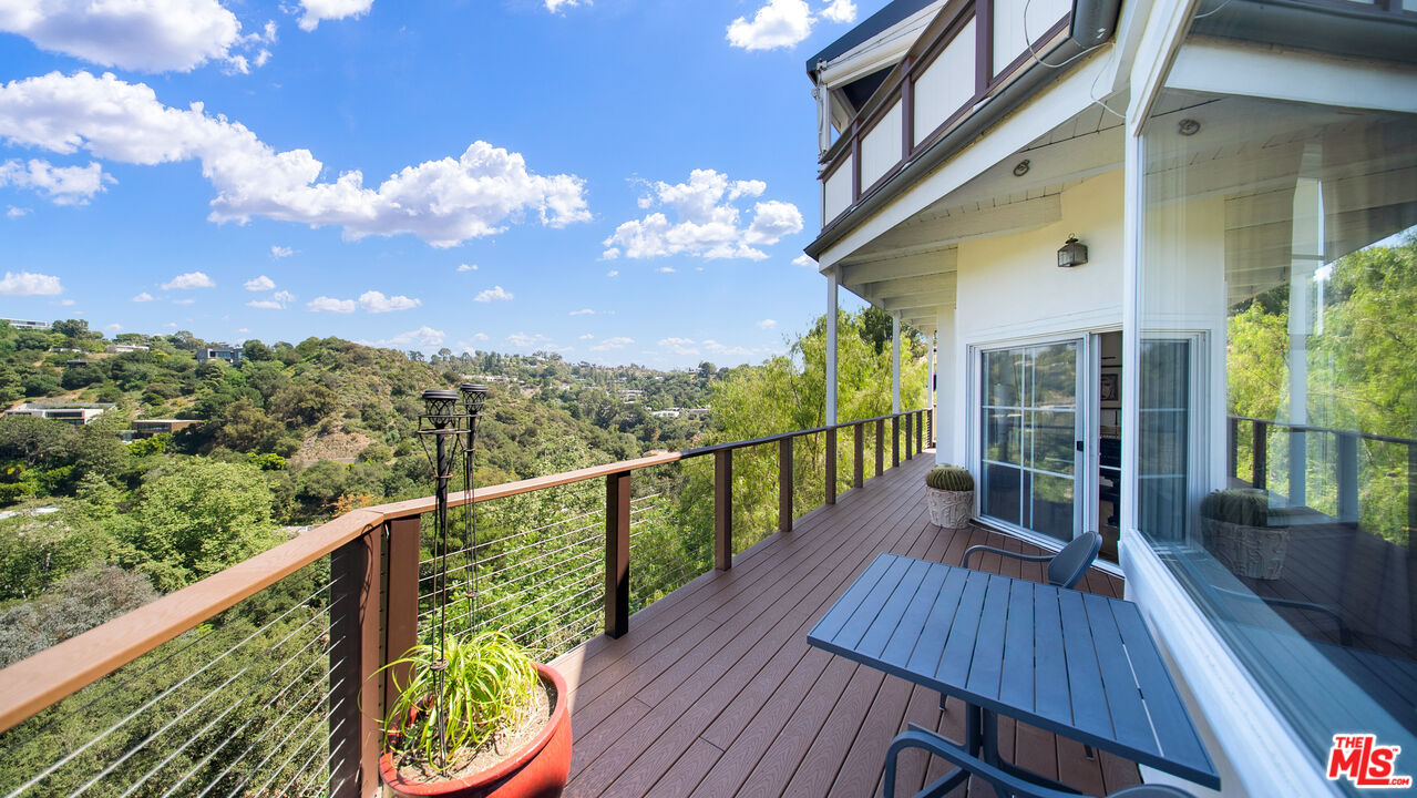 2312 Kimridge Road Beverly Hills, CA 90210 - Photo 26 of 60 a view of a balcony with wooden floor
