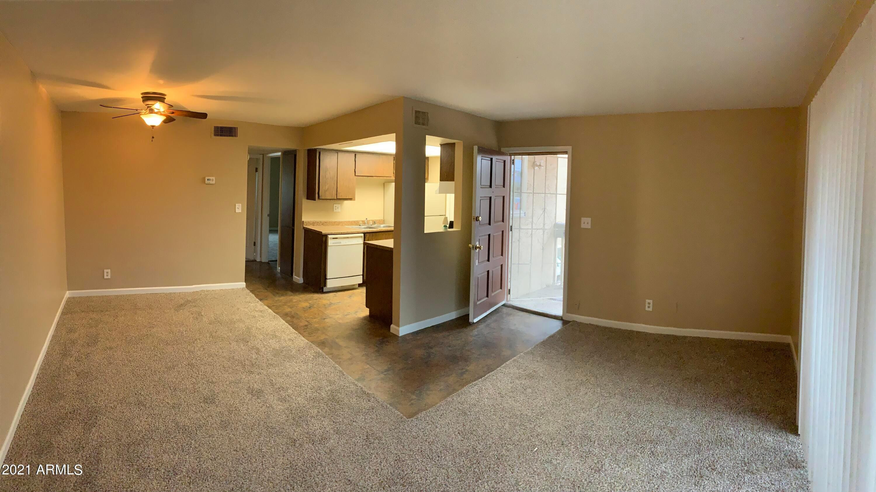 2217 East Cactus Road, Unit 4 Phoenix, AZ 85022 - Photo 8 of 14 a view of an empty room with a window