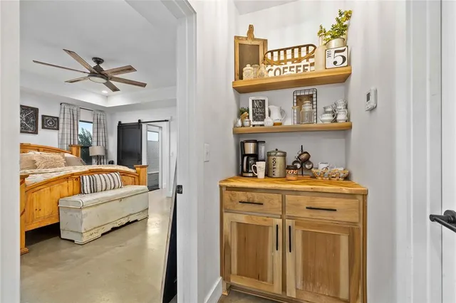 a bed room with furniture and a flat screen tv