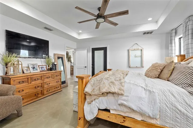 a spacious en suite bathroom with a double vanity sink and a mirror