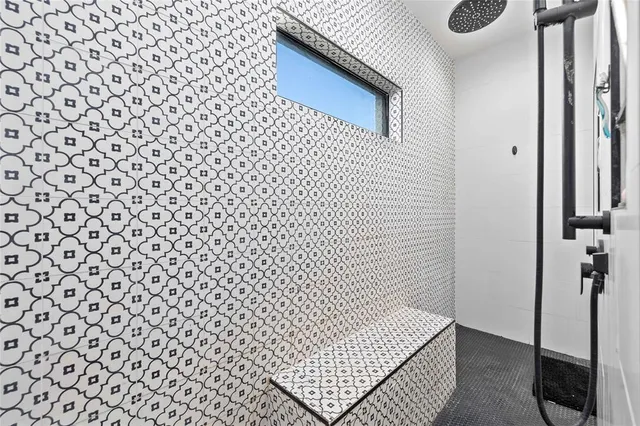 a bedroom with furniture and a flat screen tv