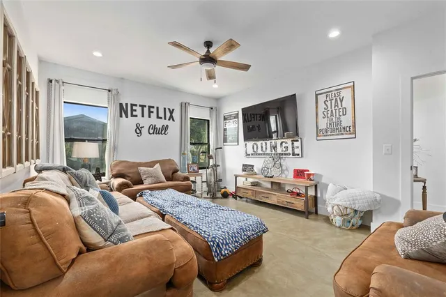 a bedroom with bed and a chandelier