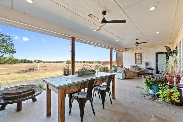 a view of a dining room with furniture window and outside view