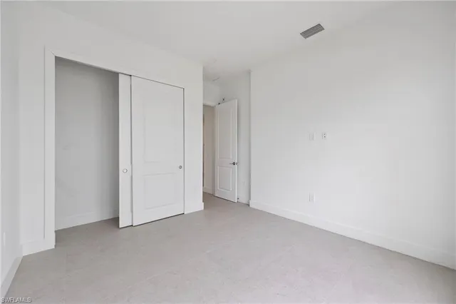 a view of kitchen and white kitchen