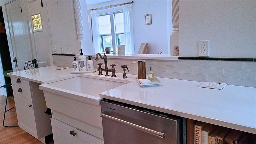 68 Clark Street Worcester, MA 01606 - Photo 17 of 42 a kitchen with a sink cabinets and wooden floor