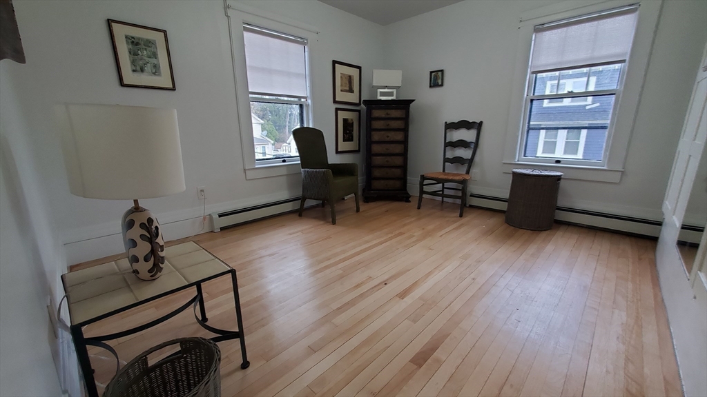 68 Clark Street Worcester, MA 01606 - Photo 21 of 42 a living room with furniture and wooden floor