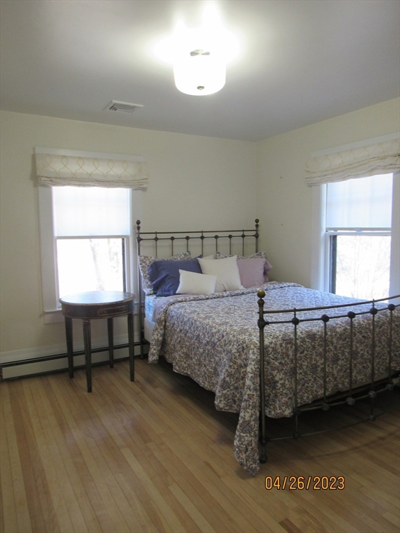 68 Clark Street Worcester, MA 01606 - Photo 27 of 42 a bedroom with a bed window and a table in it