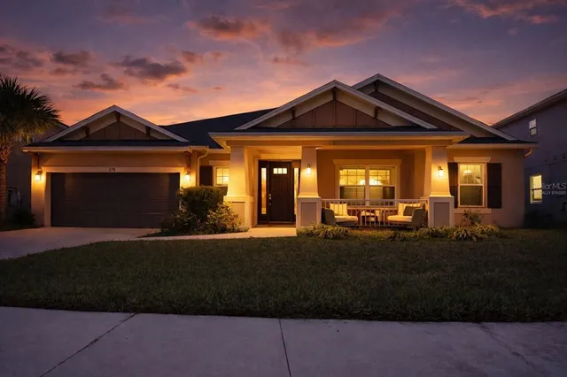 a front view of a house with yard