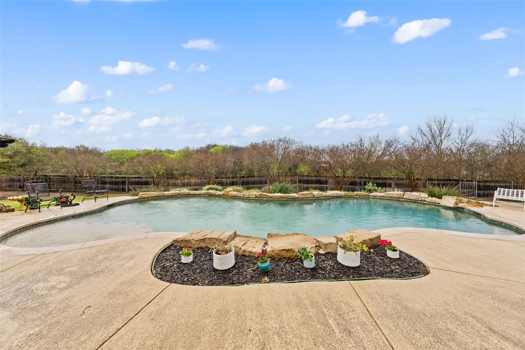 517 Chado Lane Robinson, TX 76706 - Photo 29 of 40 View of swimming pool featuring patio surround and a fenced backyard