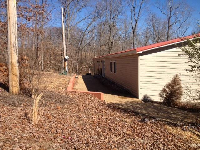 402 Ribbon Branch Road Dover, TN 37058 - Photo 2 of 15 Back of the home, showing the patio that runs the length of the home.