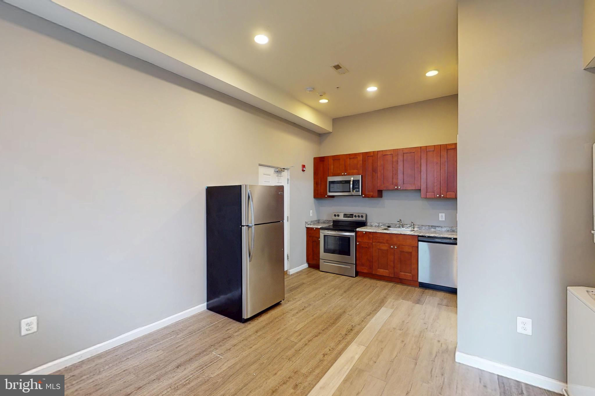 2202 Maryland Avenue, Unit R4 Baltimore, MD 21218 - Photo 2 of 11 Modern kitchen with sleek appliances.