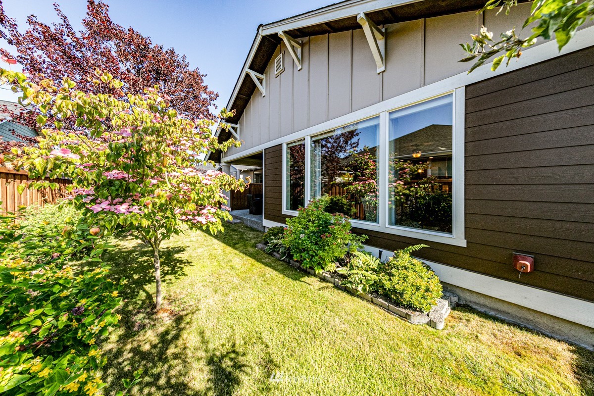 431 Lofgrin Road Sequim, WA 98382 - Photo 30 of 35 a front view of a house with a yard