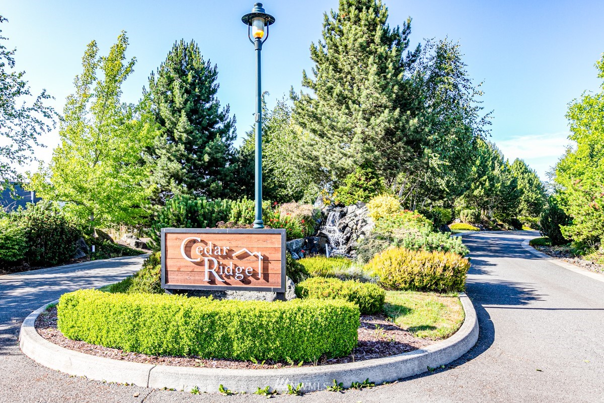431 Lofgrin Road Sequim, WA 98382 - Photo 31 of 35 a sign on the side of the road