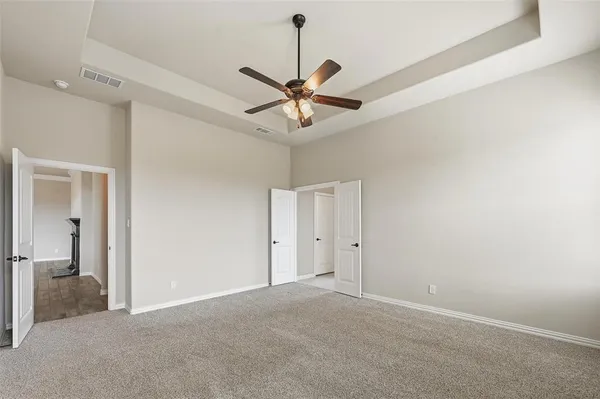 a view of a chandelier fan in a room