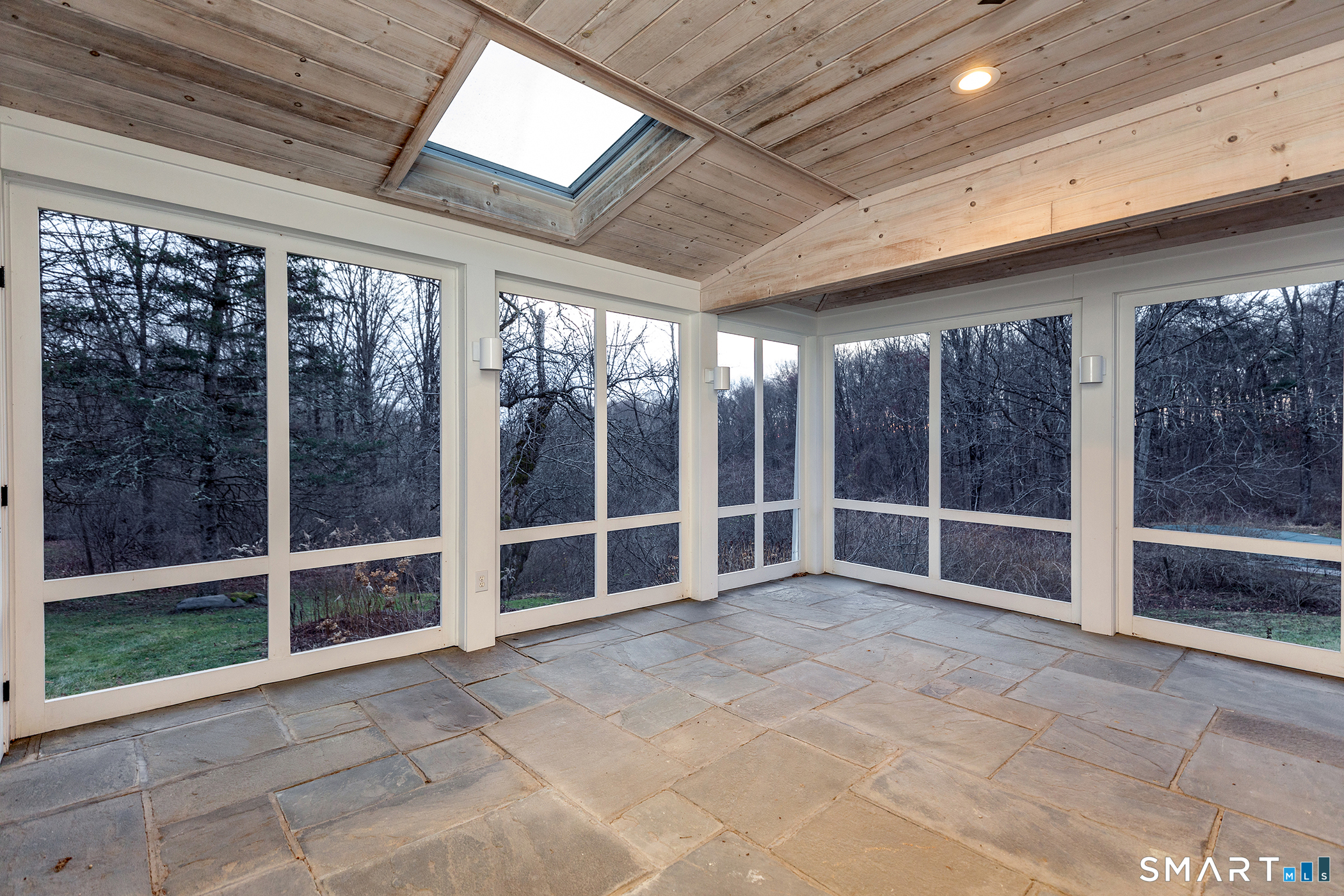 197 Skyline Ridge Road Bridgewater, CT 06752 - Photo 12 of 31 a view of an empty room with wooden floor and a window